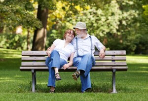 Senior couple sitting on a park bench