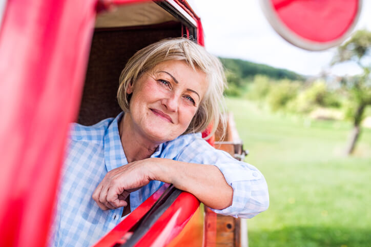make the most of medicare Close up of senior woman in checked blue shirt inside vintage pickup truck